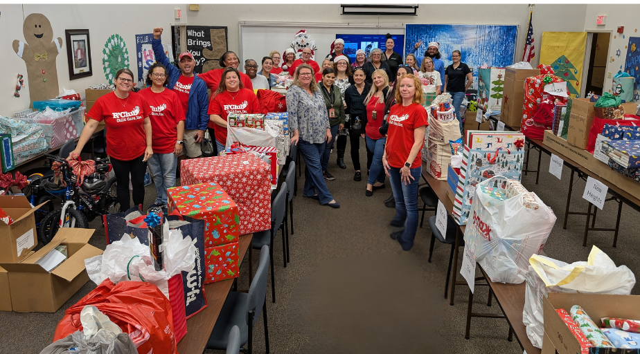 Tax Collector and  R’Club employees with holiday gift donations.