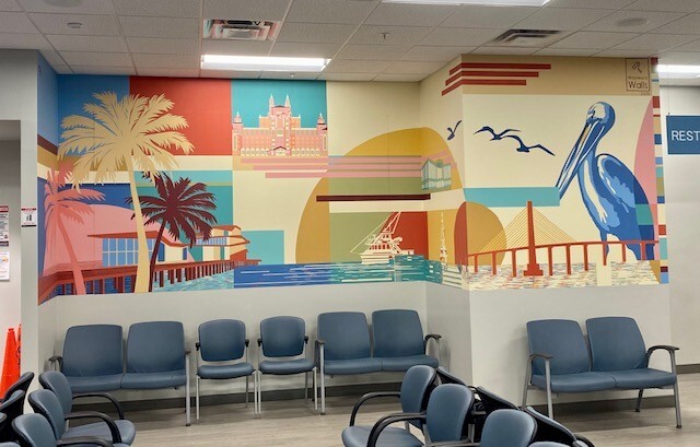 St. Pete office mural featuring the Don CeSar, St. Pete Pier, boats, pelicans, and the Skyway bridge